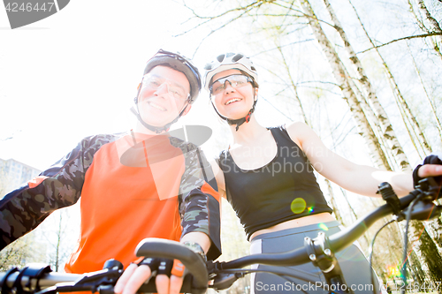 Image of Girl and guy in helmets