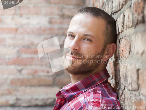Image of man portrait at the brick wall