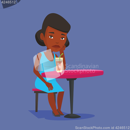 Image of Woman drinking cocktail at the bar.