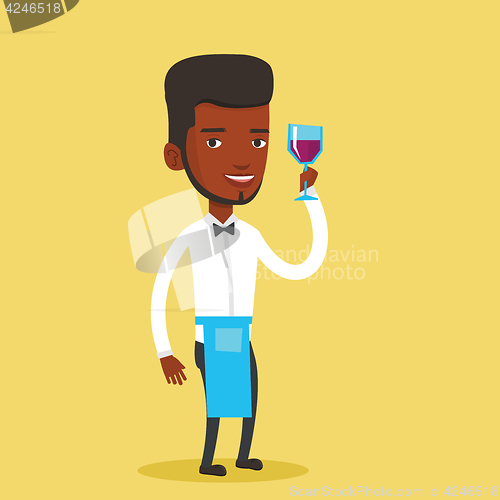 Image of Bartender holding a glass of wine in hand.