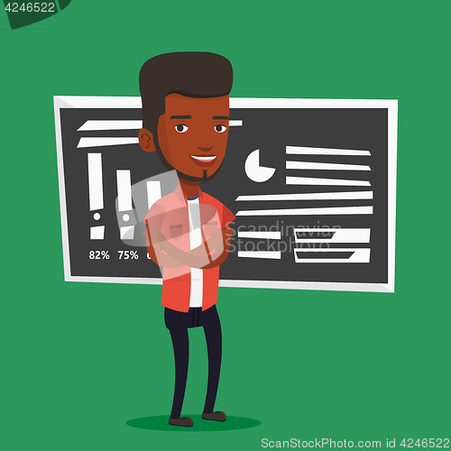 Image of Teacher or student standing in front of chalkboard