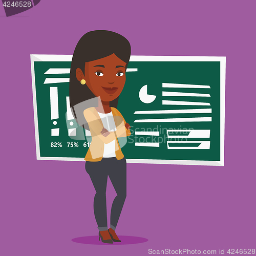 Image of Teacher or student standing in front of chalkboard