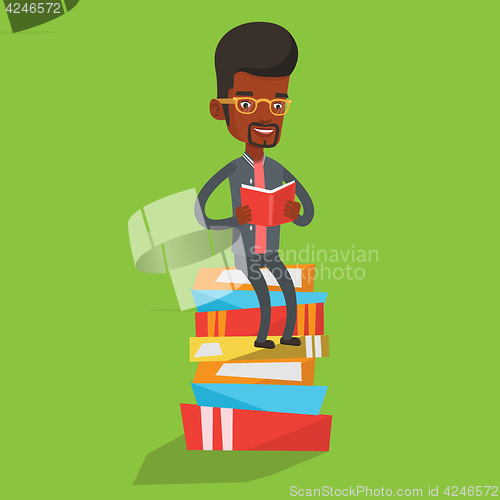 Image of Student sitting on huge pile of books.