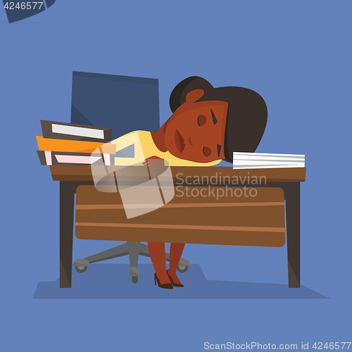 Image of Female student sleeping at the desk with book.