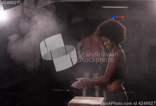 Image of black woman preparing for climbing workout
