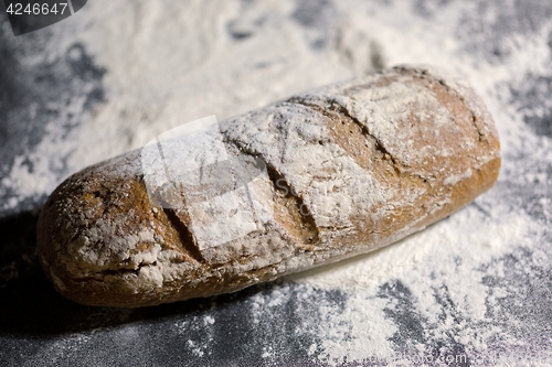 Image of Fully baked bread on flour