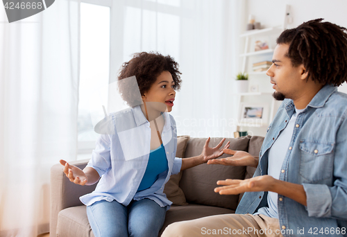 Image of unhappy couple having argument at home