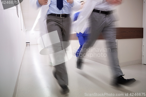 Image of close up of medics or doctors running at hospital