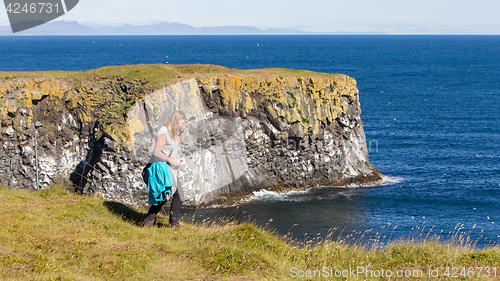 Image of Woman on the edge of the cliff - Iceland
