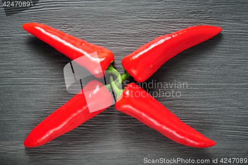 Image of Sweet red Kapia peppers on a dark shale