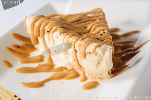 Image of Delicious cheesecake with caramel topping