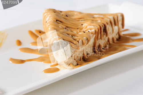 Image of Delicious cheesecake with caramel topping