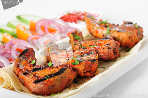 Image of Grilled lamb tongues with fresh vegetables salad