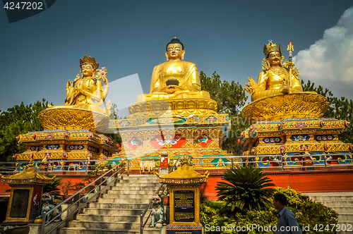 Image of Three golden statues