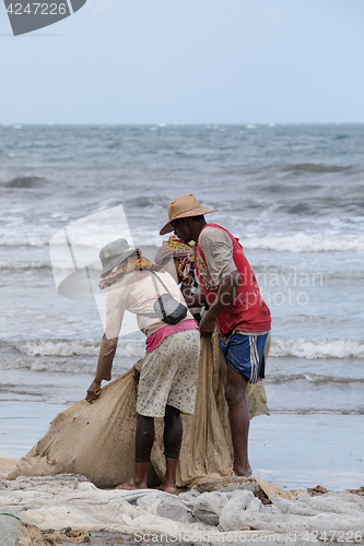 Image of Native Malagasy fishermen fishing on sea, Madagascar