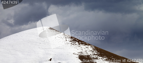 Image of Panoramic view on off piste slope and overcast gray sky