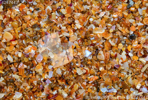 Image of Multicolor sand on beach in sun summer day