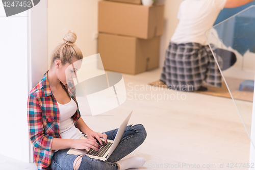 Image of Happy couple doing home renovations