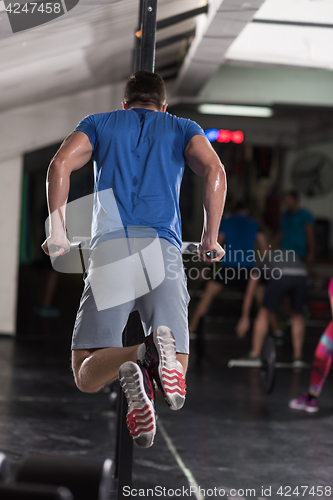 Image of man doing exercises parallel bars