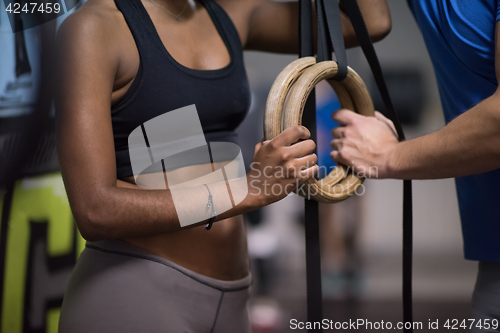 Image of Portrait of multiethnic couple  after workout at gym