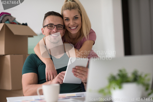 Image of Young couple moving in a new home