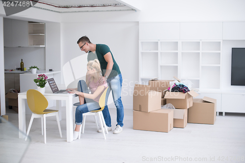 Image of Young couple moving in a new home