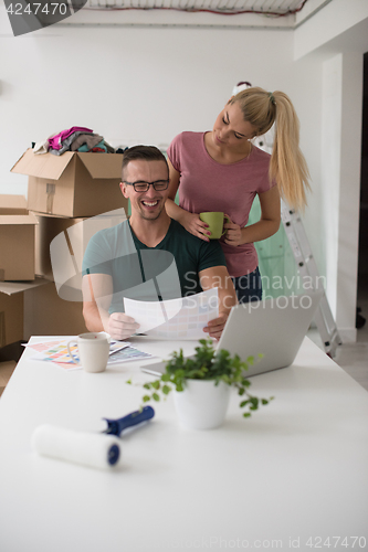 Image of Young couple moving in a new home