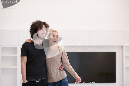 Image of couple hugging in their new home