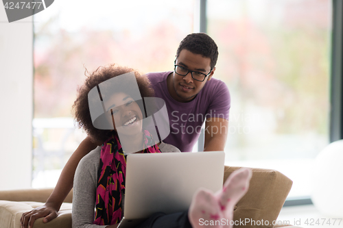 Image of african american couple shopping online