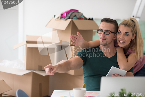 Image of Young couple moving in a new home