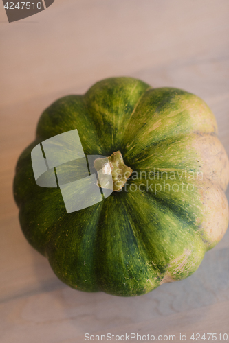 Image of pumpkin on a wooden table