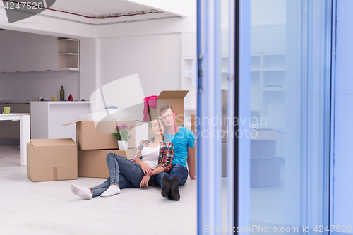 Image of young couple moving  in new house