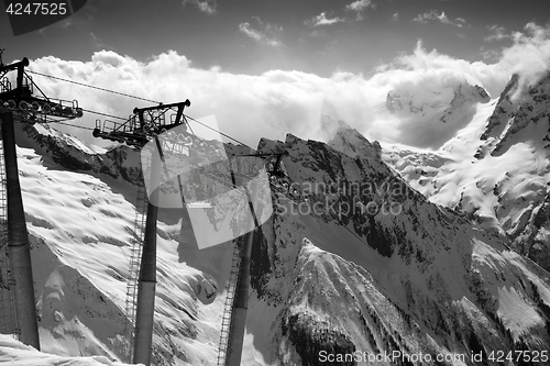 Image of Black and white view on cable car at ski resort and mountains