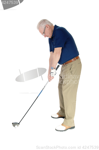 Image of Senior practicing golf at home.