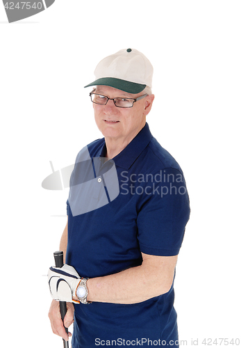 Image of Senior man standing with golf hat.