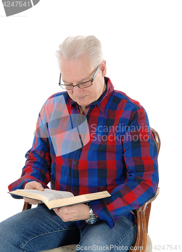 Image of Senior man studding the bible.