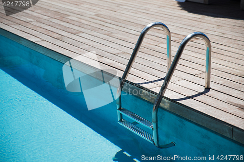 Image of outdoor swimming pool ladder