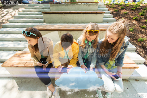 Image of happy teenage friends with smartphones outdoors