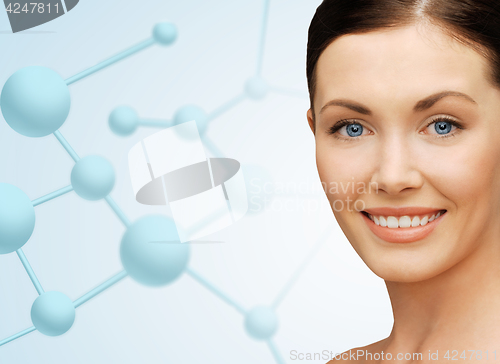 Image of beautiful young woman face with molecules