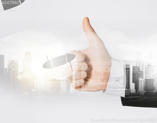 Image of businessman hand showing thumbs up