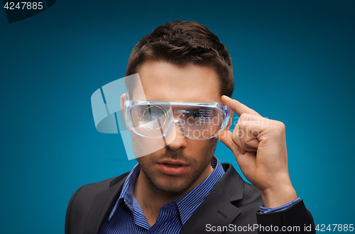 Image of businessman in virtual reality or 3d glasses