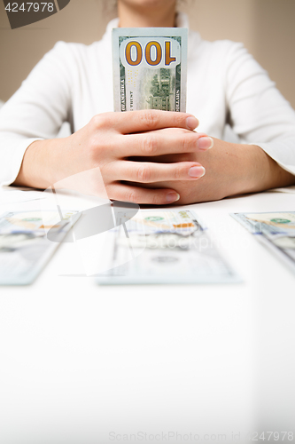 Image of Woman hands holding money