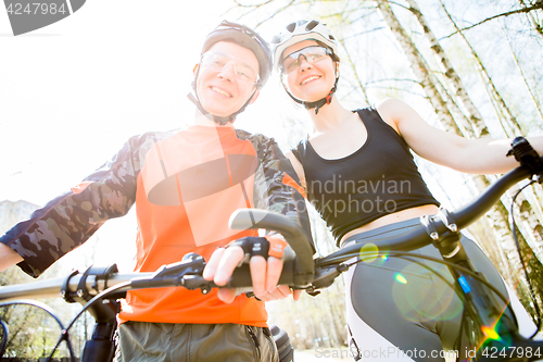 Image of Man with woman in helmets