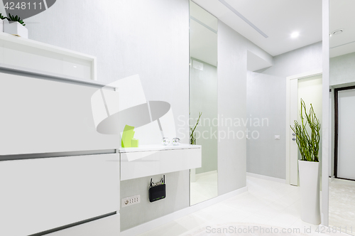 Image of modern white apartment hallway
