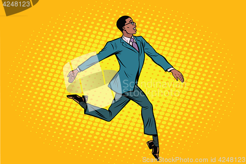 Image of African businessman runs forward elegantly