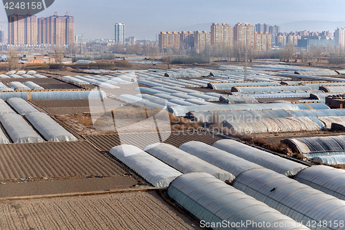 Image of Greenhouses on agricultural field outside the city