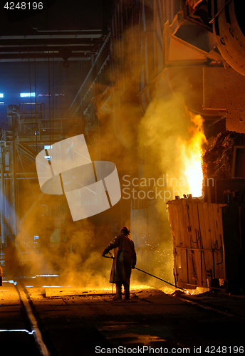 Image of steel worker inside of steel plant