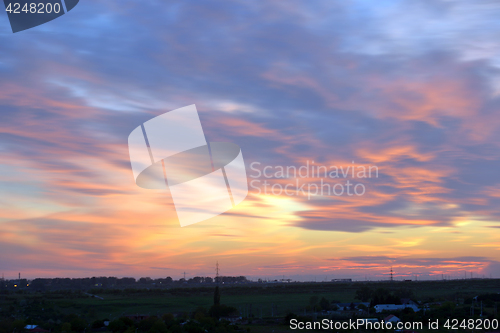 Image of Dramatic sunset over city 