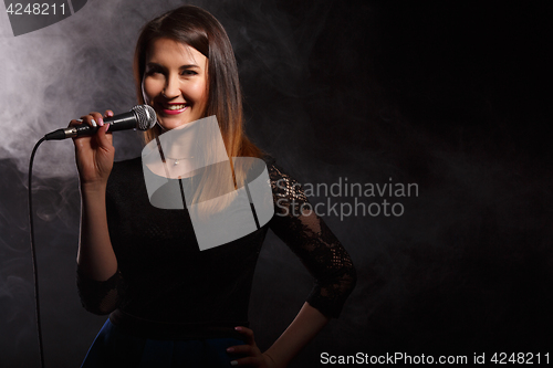 Image of Singer on background of smoke