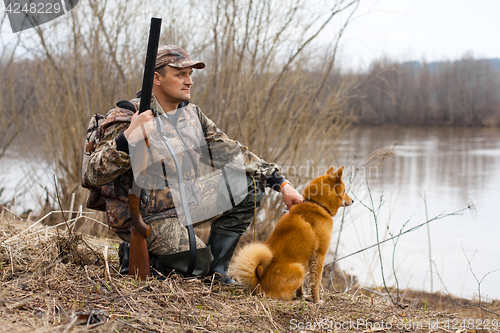 Image of hunter on the shore